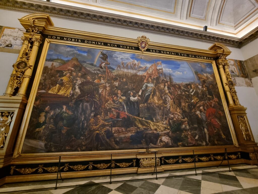 Wielki, ozdobiony złotem obraz przedstawiający scenę bitwy, wiszący w jednej z galerii Muzeów Watykańskich. Jan Matejko "Sobieski pod Wiedniem - 1683"